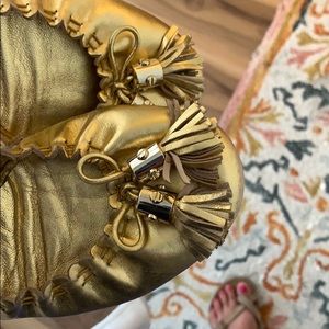 Tory Burch gold tassel flats